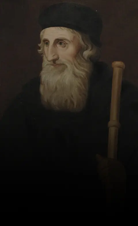 Retrato de um reformador de barba longa e gorro preto, segurando um cajado